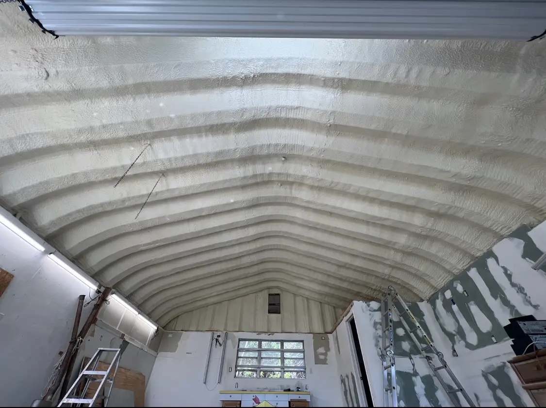 Spray polyurethane foam applied to the underside of a metal roof deck in Almena